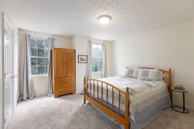 6258 Tetlin Field Dr, New Albany, OH 43054 - bedroom with light colored carpet and a textured ceiling