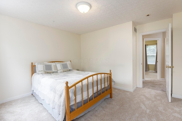 6258 Tetlin Field Dr, New Albany, OH 43054 - bedroom with carpet and a textured ceiling