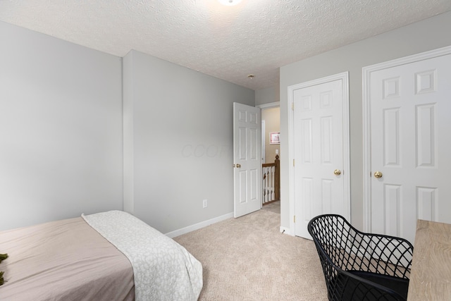 6258 Tetlin Field Dr, New Albany, OH 43054 - carpeted bedroom featuring a textured ceiling and baseboards