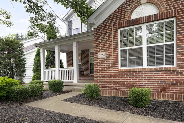 6258 Tetlin Field Dr, New Albany, OH 43054 - property entrance with brick siding and a porch