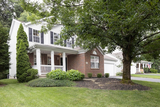 6258 Tetlin Field Dr, New Albany, OH 43054 - traditional-style home featuring a porch, driveway, a front lawn, a garage, and brick siding