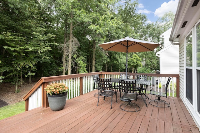 6258 Tetlin Field Dr, New Albany, OH 43054 - wooden terrace featuring outdoor dining area and view of wooded area