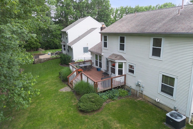 6258 Tetlin Field Dr, New Albany, OH 43054 - rear view of house with a shingled roof, a deck, and a lawn