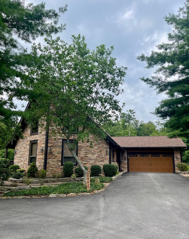 5482 Blacklick-Eastern Rd NW, Pickerington, OH 43147 - view of front facade featuring stone siding, asphalt driveway, and an attached garage
