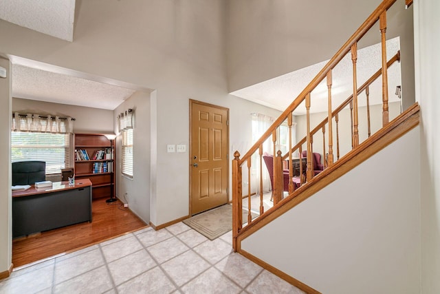 4224 Eagle Head Dr, Columbus, OH 43230 - entrance foyer with stairway and a textured ceiling