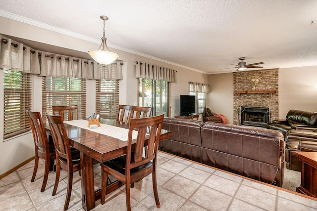4224 Eagle Head Dr, Columbus, OH 43230 - dining space with ceiling fan, a textured ceiling, crown molding, and a fireplace