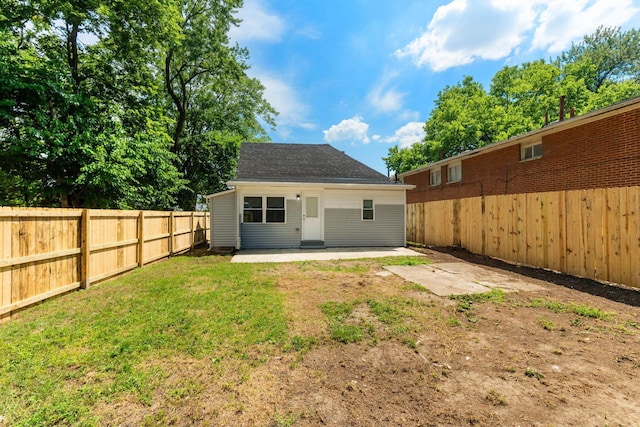 1612 Cole St, Columbus, OH 43205 - rear view of property with a patio, a fenced backyard, and roof with shingles
