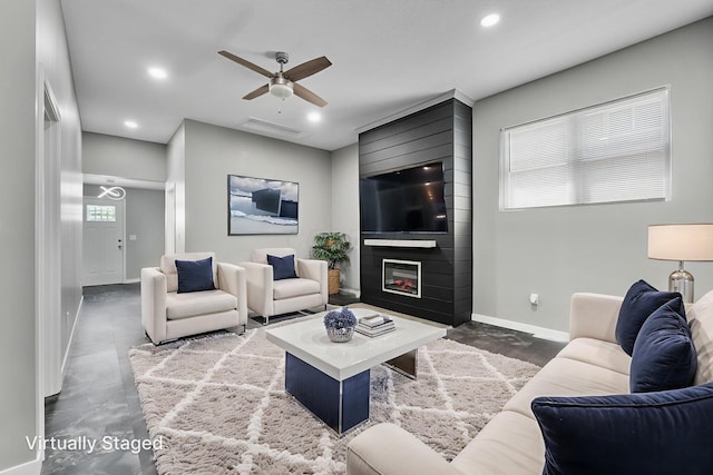 1612 Cole St, Columbus, OH 43205 - living room with ceiling fan, recessed lighting, a large fireplace, and finished concrete flooring