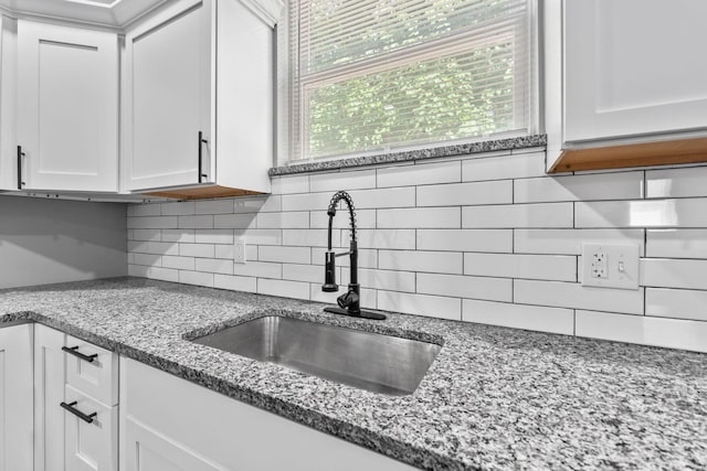 1612 Cole St, Columbus, OH 43205 - kitchen featuring tasteful backsplash, white cabinetry, and light stone countertops