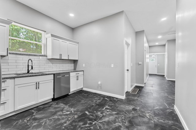 1612 Cole St, Columbus, OH 43205 - kitchen with dishwasher, tasteful backsplash, white cabinets, dark marble finish floors, and recessed lighting