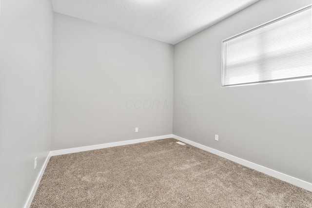 1612 Cole St, Columbus, OH 43205 - empty room featuring carpet floors and baseboards
