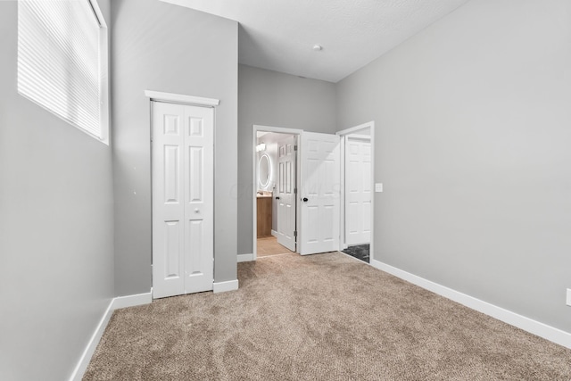 1612 Cole St, Columbus, OH 43205 - unfurnished bedroom with carpet, a closet, and ensuite bathroom