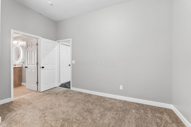 1612 Cole St, Columbus, OH 43205 - unfurnished bedroom with light carpet and ensuite bathroom