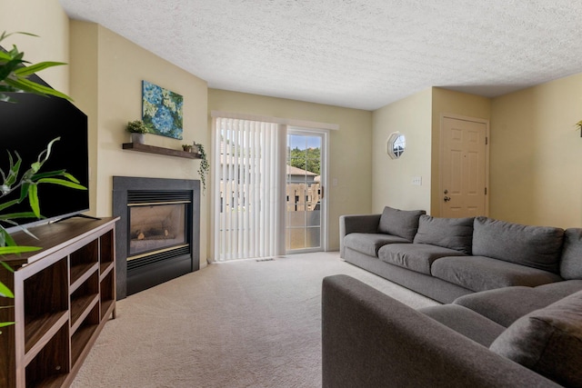 4109 Blendon Way Dr Unit 99E, Columbus, OH 43230 - living area featuring a glass covered fireplace, carpet, and a textured ceiling