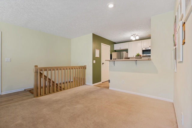 4109 Blendon Way Dr Unit 99E, Columbus, OH 43230 - empty room featuring light colored carpet and a textured ceiling