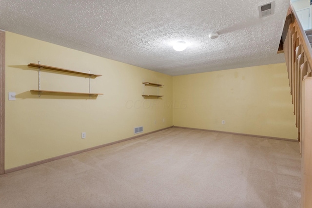 4109 Blendon Way Dr Unit 99E, Columbus, OH 43230 - spare room featuring light colored carpet, a textured ceiling, and a smoke detector