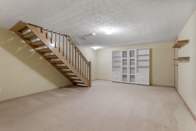 4109 Blendon Way Dr Unit 99E, Columbus, OH 43230 - finished below grade area featuring stairs, carpet floors, and a textured ceiling
