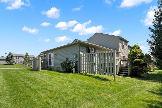 4109 Blendon Way Dr Unit 99E, Columbus, OH 43230 - view of side of property with a lawn and a wooden deck
