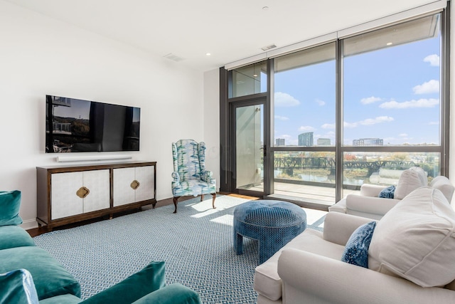 250 W Spring St Unit 626, Columbus, OH 43215 - living room featuring floor to ceiling windows and a city view