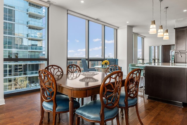 250 W Spring St Unit 626, Columbus, OH 43215 - dining space featuring a wall of windows and dark wood-type flooring