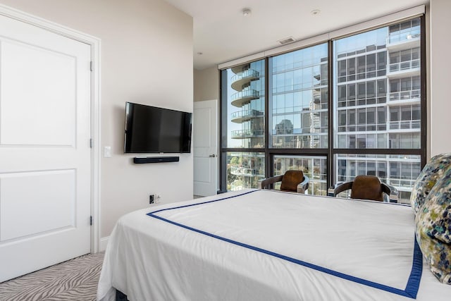 250 W Spring St Unit 626, Columbus, OH 43215 - bedroom featuring multiple windows and a wall of windows