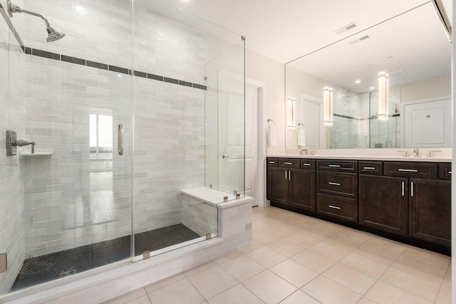 250 W Spring St Unit 626, Columbus, OH 43215 - bathroom with tile patterned floors, double vanity, and a shower stall