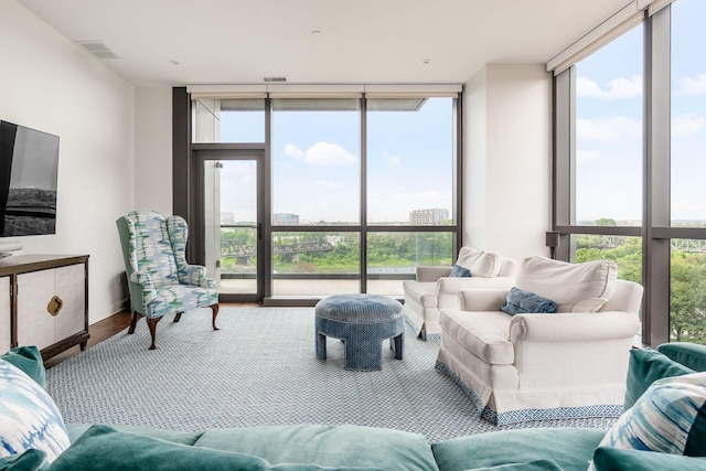 250 W Spring St Unit 626, Columbus, OH 43215 - living area with floor to ceiling windows, plenty of natural light, and wood finished floors