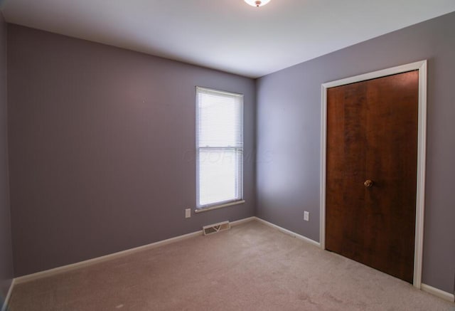 1206 Crescent Heights Rd, Marion, OH 43302 - unfurnished bedroom with multiple windows and carpet floors
