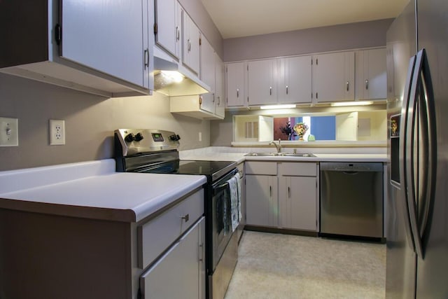 1206 Crescent Heights Rd, Marion, OH 43302 - kitchen featuring stainless steel appliances, under cabinet range hood, and light countertops
