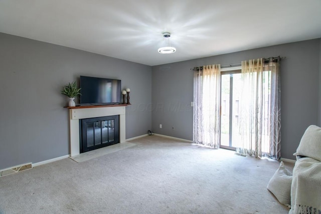 1206 Crescent Heights Rd, Marion, OH 43302 - unfurnished living room featuring carpet floors and a fireplace with flush hearth