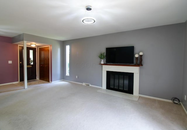 1206 Crescent Heights Rd, Marion, OH 43302 - unfurnished living room with carpet floors and a glass covered fireplace