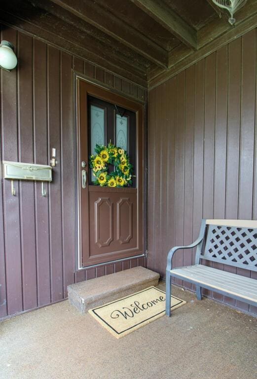 1206 Crescent Heights Rd, Marion, OH 43302 - view of exterior entry with board and batten siding