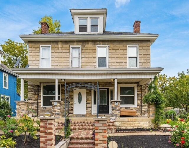 1364 E Fulton St, Columbus, OH 43205 - traditional style home with covered porch, a chimney, and stone siding