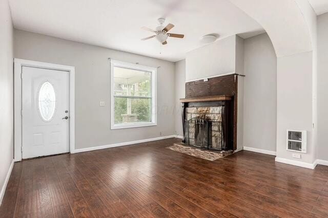 1364 E Fulton St, Columbus, OH 43205 - unfurnished living room featuring hardwood / wood-style floors, ceiling fan, arched walkways, and a fireplace