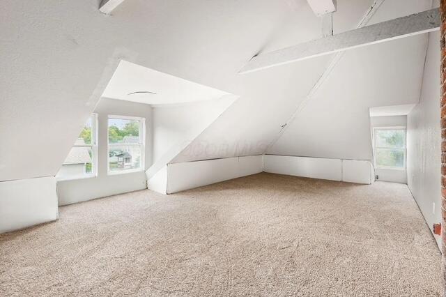 1364 E Fulton St, Columbus, OH 43205 - bonus room featuring lofted ceiling, carpet, and healthy amount of natural light