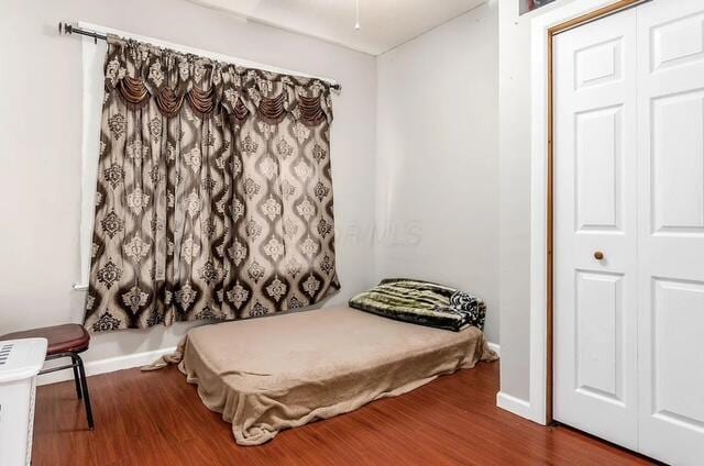 1364 E Fulton St, Columbus, OH 43205 - bedroom featuring wood finished floors and a closet