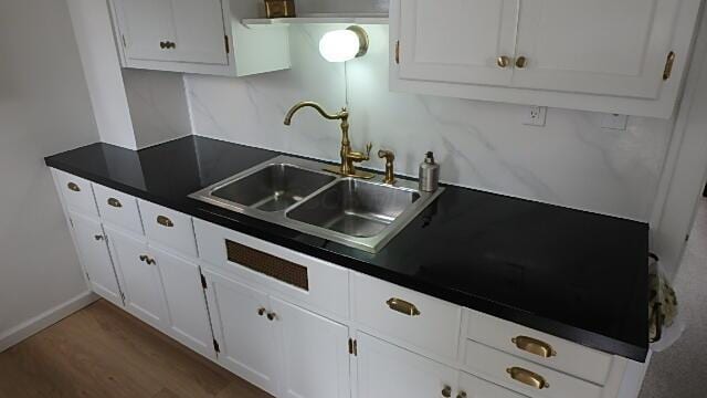 1483 Elmwood Ave, Columbus, OH 43212 - kitchen featuring dark countertops, white cabinetry, and wood finished floors