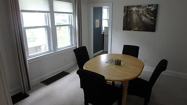 1483 Elmwood Ave, Columbus, OH 43212 - dining room with healthy amount of natural light and light carpet