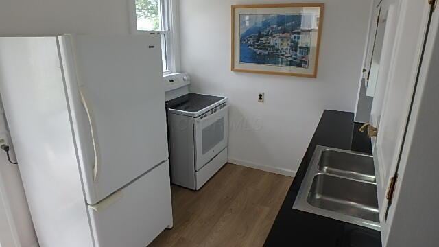 1483 Elmwood Ave, Columbus, OH 43212 - kitchen with white appliances and wood finished floors