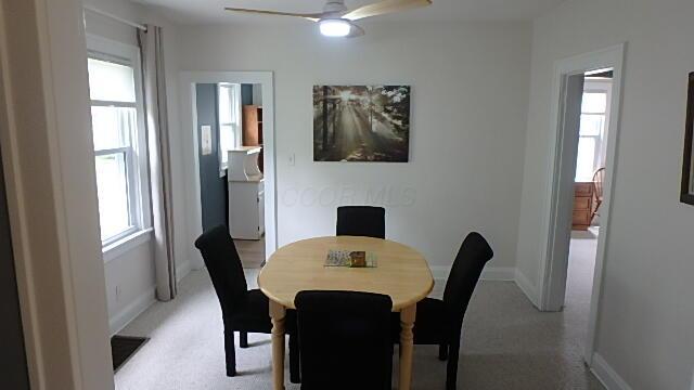 1483 Elmwood Ave, Columbus, OH 43212 - dining space featuring plenty of natural light, ceiling fan, and light colored carpet