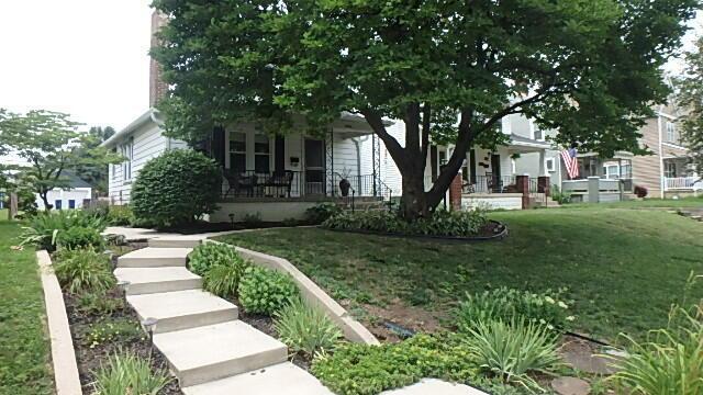 1483 Elmwood Ave, Columbus, OH 43212 - view of property hidden behind natural elements with a porch and a front yard