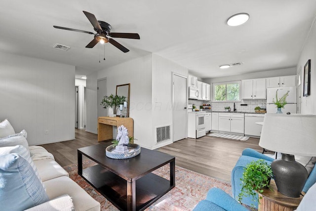1556 Vilardo Ln, Columbus, OH 43227 - living area with ceiling fan and wood finished floors