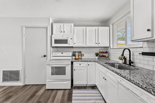 1556 Vilardo Ln, Columbus, OH 43227 - kitchen featuring white appliances, dark wood-style flooring, white cabinetry, tasteful backsplash, and stone countertops