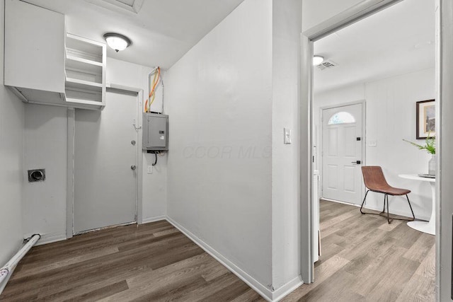1556 Vilardo Ln, Columbus, OH 43227 - washroom with electric panel, wood finished floors, and electric dryer hookup