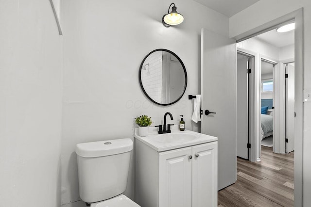 1556 Vilardo Ln, Columbus, OH 43227 - bathroom featuring vanity, wood finished floors, and ensuite bath