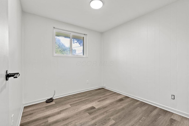 1556 Vilardo Ln, Columbus, OH 43227 - spare room featuring wood finished floors and baseboards