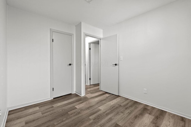 1556 Vilardo Ln, Columbus, OH 43227 - unfurnished bedroom with wood finished floors and baseboards