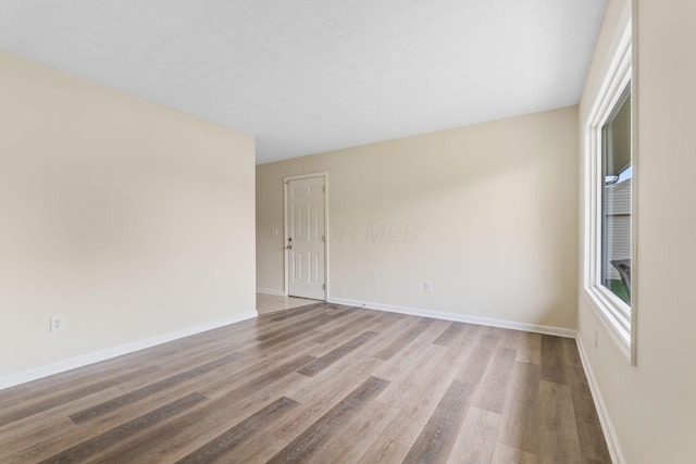 893 Aladdin Ct, Columbus, OH 43207 - spare room featuring wood finished floors and baseboards