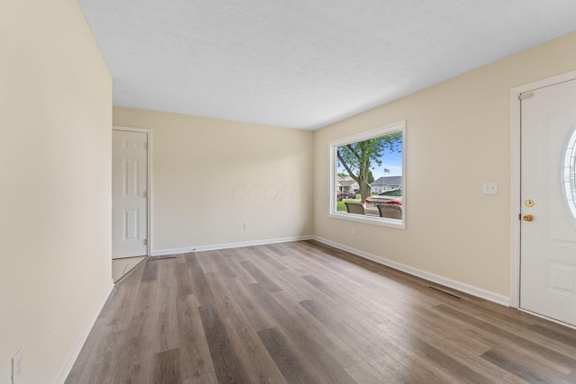 893 Aladdin Ct, Columbus, OH 43207 - entrance foyer featuring wood finished floors and a textured ceiling