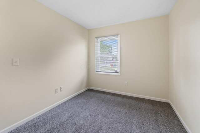 893 Aladdin Ct, Columbus, OH 43207 - empty room with dark colored carpet